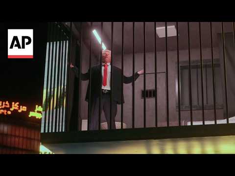 A billboard in Iran shows an actor portraying Trump behind bars