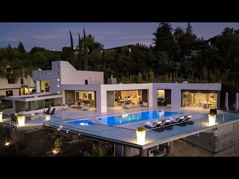 Listing for $5.5M, This striking home in Encino CA boasts unexpected materials and stunning views