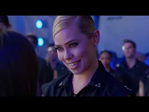 Official Pitch Perfect 2 trailer still: the Barden Bellas framed in spotlight before the World Championship crowd