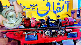 A very old crank shaft machine broke down. The mechanic is repairing it