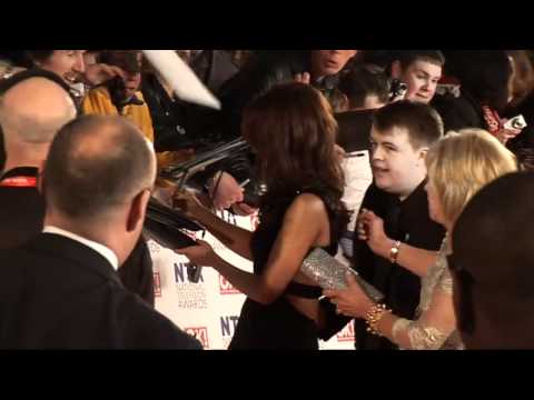 Cheryl Cole shows off new tattoo at NTAs