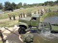 KrAZ 255 Resetting the pontoon bridge. Military equipment.