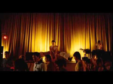 Trailer frame hinting at back-room record swaps and mixtape culture that Disc 2 channels