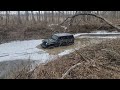 JKU Rubicon on 37's busting through ice buried in creek!