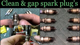 Cleaning and gapping spark plugs for a Ford 302.