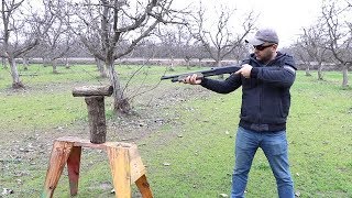 splitting wood with a shotgun