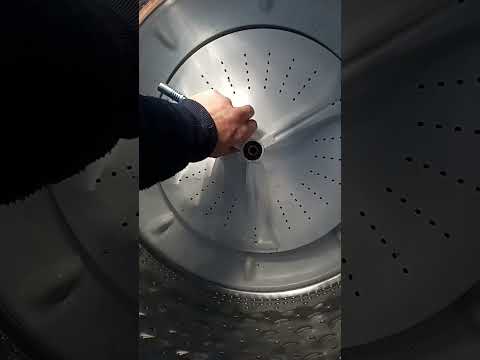 Maytag washer agitator disc removed with ratchet strap and wood