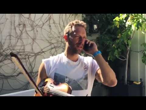 Chris Martin playing the violin