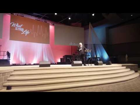 Roland Baker preaching