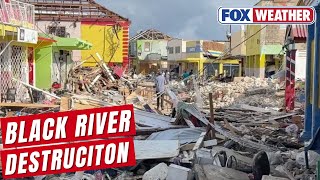 Download lagu Trudging through rubble amid devastation from Hurricane Melissa in Black River, Jamaica. mp3