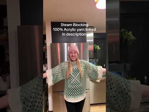 Part of a video titled Washed and drying my 100% acrylic yarn granny square sweater