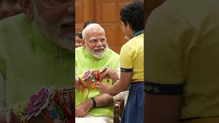 PM Modi celebrates Raksha Bandhan with school children | #shorts