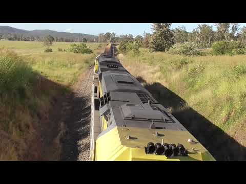 Qube Industries QL012/QL011 lead a Steel Service South through Kagaru on 2BW7 3/1/22