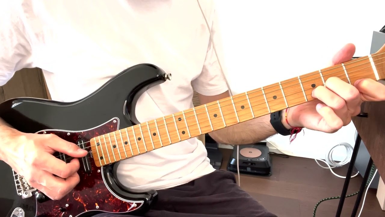 Roberto Barlocci playing the Love Yourself intro riff on guitar