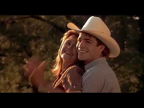 Trailer shot of a slow dance under string lights, echoing the soundtrack’s romantic cues