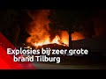 Metershoge vlammen en explosies bij brand op industrieterrein Kraaiven in Tilburg.