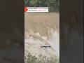 Shifen's famous waterfall has become a scary muddy torrent