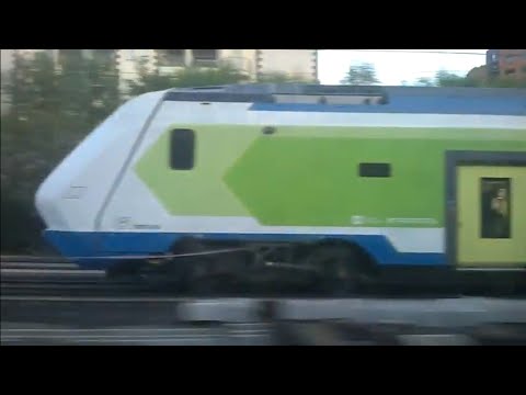 ETR521 028 Trenord in sorpasso - Sesto S. Giovanni 06/04/2021