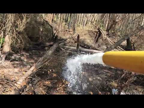 Spraying foam to cut off oxygen to these ash pits.
