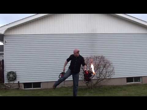 Juggling 3 chainsaws with one on fire.
