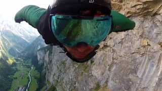 Wingsuit Base Jump through waterfall.