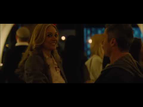 End-card trailer still: city seen from above as strings toll toward silence