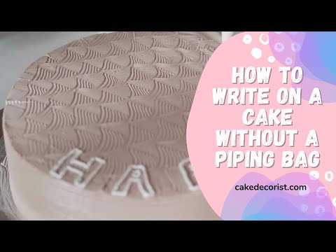 Part of a video titled How To Write On A Cake Without A Piping Bag - YouTube