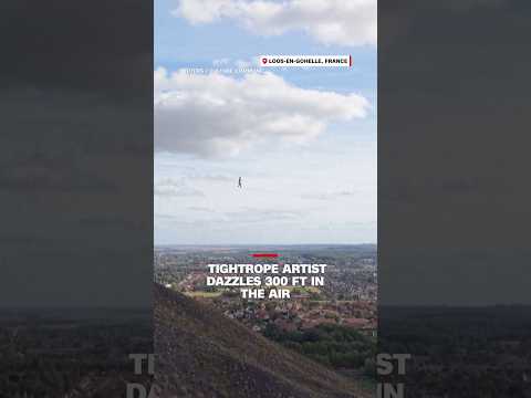 Tightrope artist dazzles 300 ft in the air