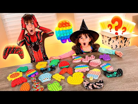 CAIXA SURPRESA DE POP IT FIDGET TOY COM MARCOS E LAURA - Família Brancoala