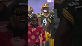 Lil Wayne leads the Green Bay Packers onto the field before the game
