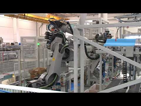 COMAU NS16 and NJ40 robots folding multilayer bags
