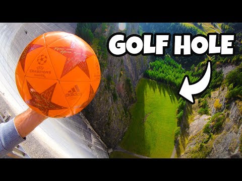 Orange soccer ball held over a steep drop with a distant green hole below and a bold 'GOLF HOLE' label overlay.