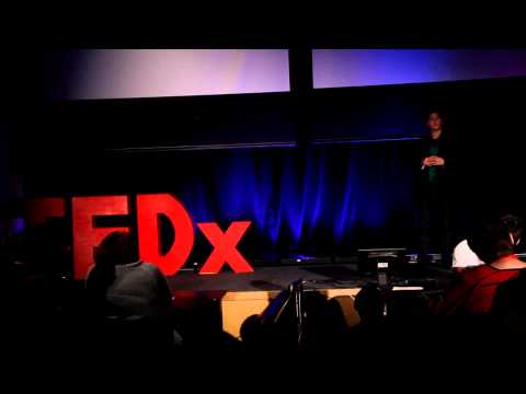 Speaker on stage at TEDxUMDearborn