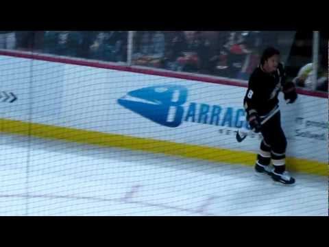 Anaheim Ducks: Teemu Selanne giving a puck to a fan during warmups on 02/04/2013