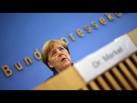Angela Merkel stands by refugee policy after attacks in Germany
