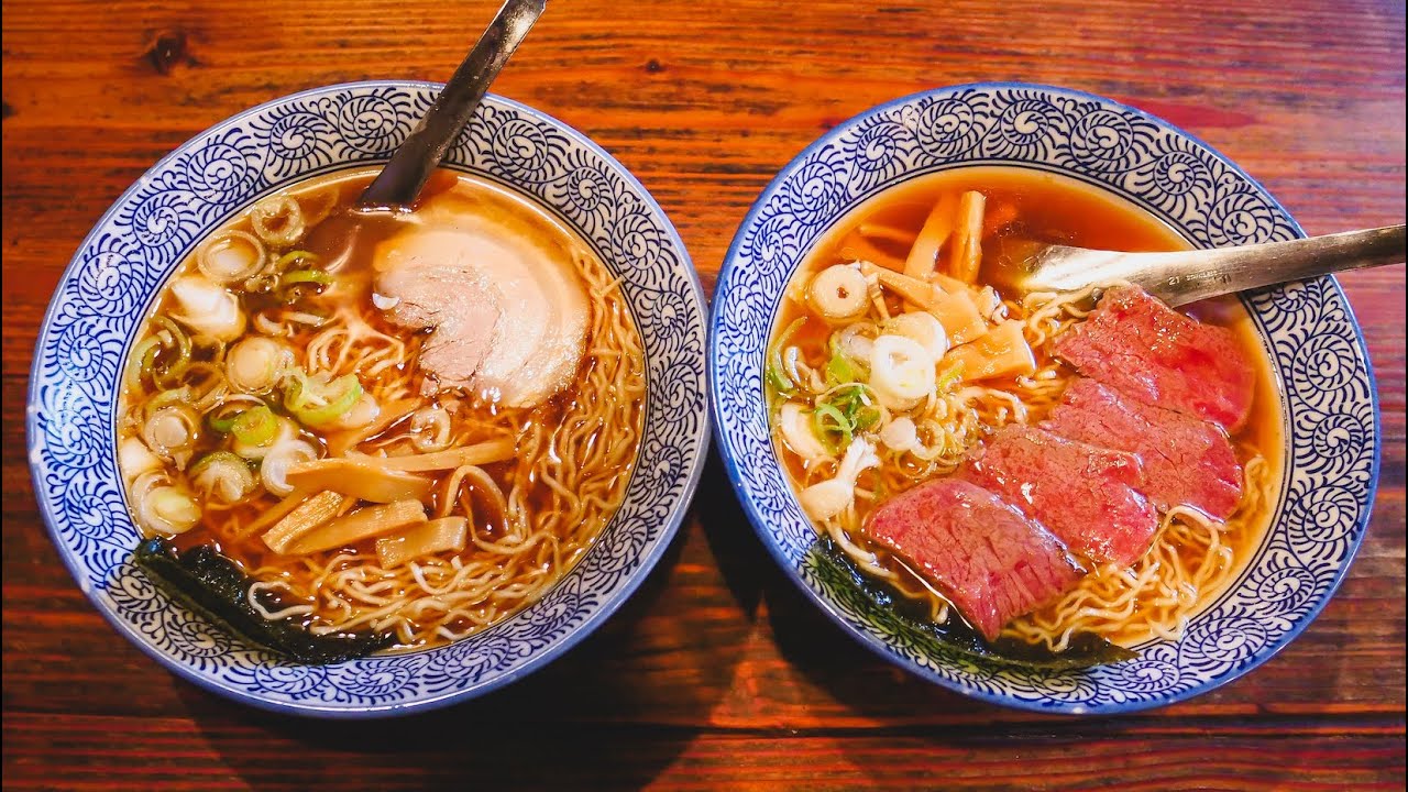 Experience the thrill as two travelers indulges in Takayama's iconic ramen!