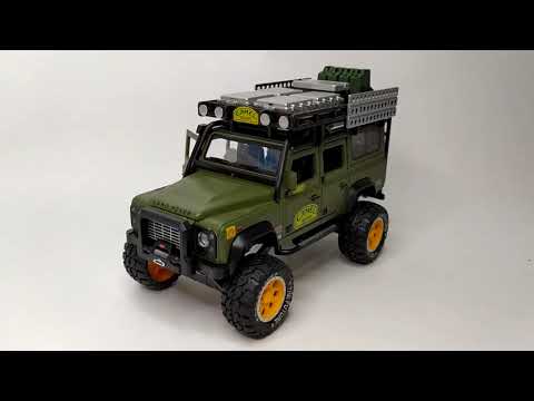 Металлическая машинка Newao Model 1:28 «Land Rover Defender» 18 см. XA2833B инерционная, свет, звук / Микс