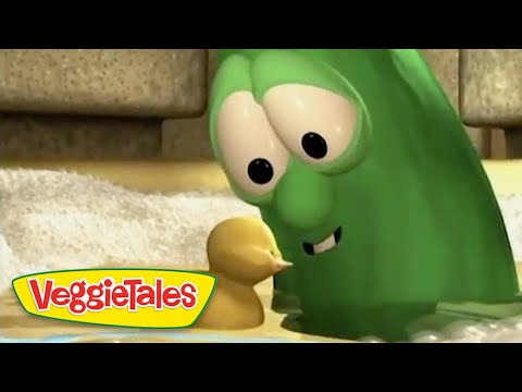 Green VeggieTales cucumber character leaning toward a small yellow duckling, with the VeggieTales logo visible in the corner.