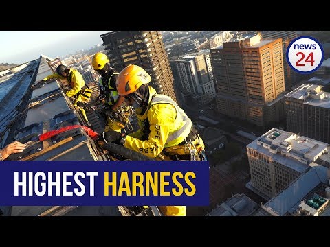 High-rise window washer working on rope access