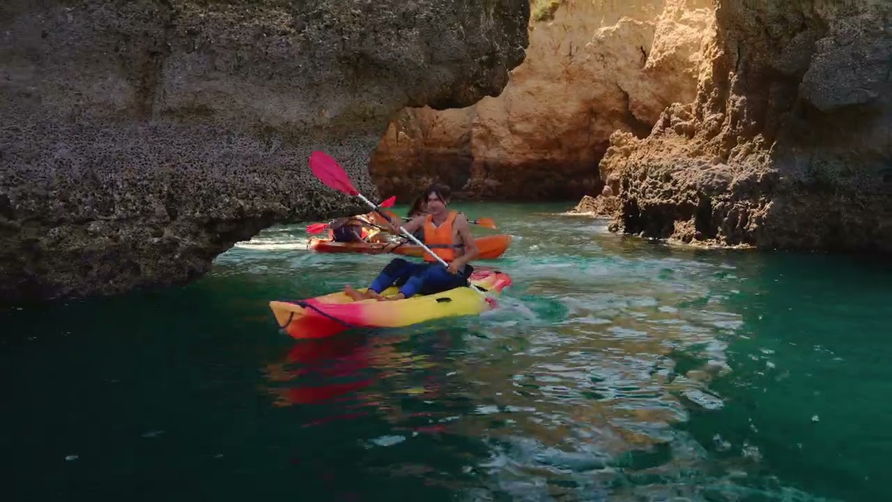 Paddle through sea caves at Ponta da Piedade.