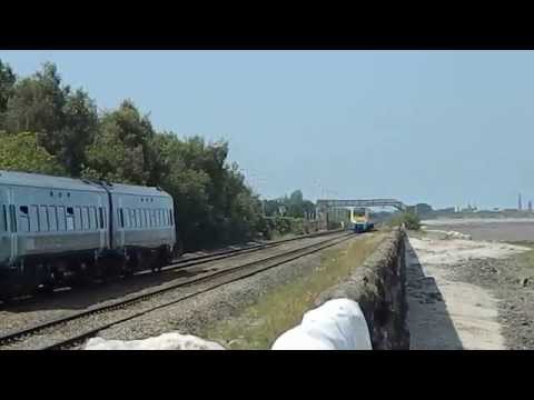 Arriva Wales trains passing next to the Dee Estuary at Ffynnongroyw Flintshire Wales UK BR