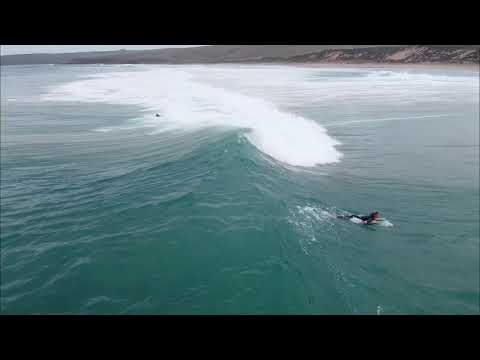 Surfing riding fun wave at Parsons Beach