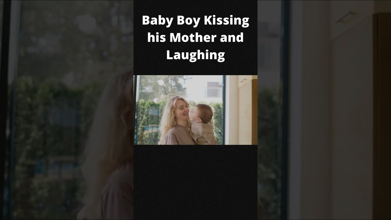 Baby Boy Kissing his Mother and Laughing