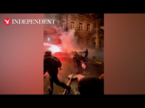 Protester shoots fireworks at police during pro EU protests in Georgia