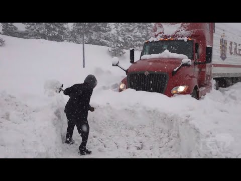 01-28-2021 Truckee, CA - Semi's buried in snow along I-80, feet of snow burying everything
