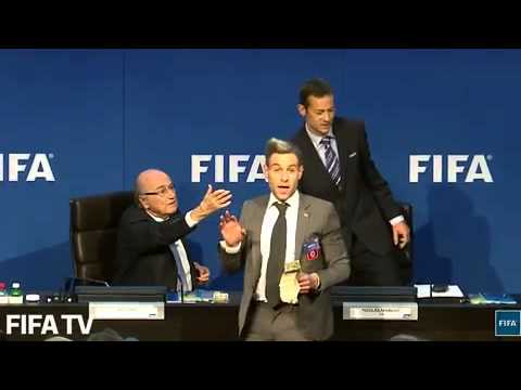 Watch the moment Sepp Blatter was showered with fake bank notes by comedian Lee Nelson