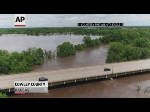 Officials aren't sure when the Kansas Turnpike will reopen near the Oklahoma border after a surging creek sent floodwaters pouring over the asphalt. (May 9)