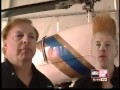 Man On Trapeze Hanging From Helicopter Is Circus Stunt