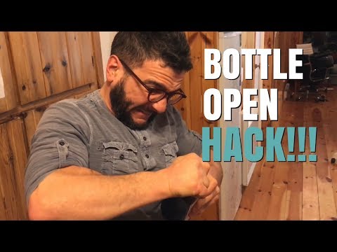 Part of a video titled OPENING STUCK TWIST-OFF CAP (WITH RUBBER BAND)!!! - YouTube