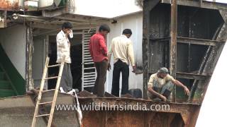 Scrap business: Workers at Alang ship-breaking yard, Gujarat